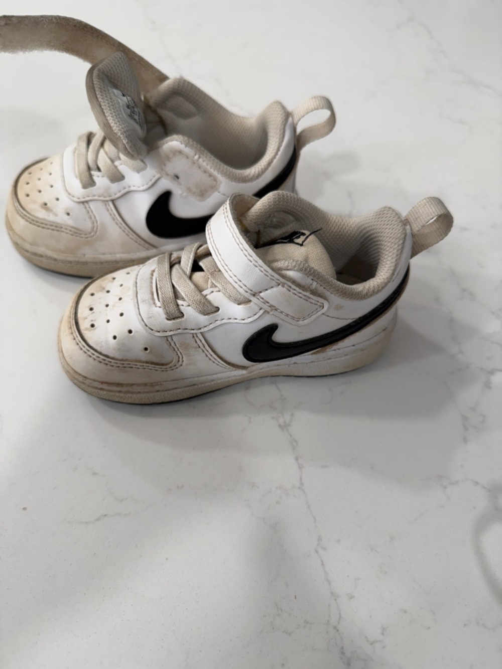 Nike Kids White Sneakers with Black Swoosh
